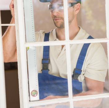 Glass technician measuring window frame – Glass Pro Dallas